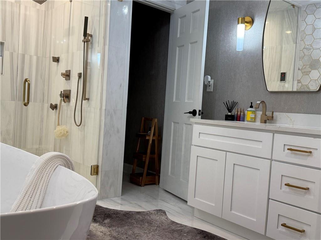 3508 Paces Place Northwest Atlanta, GA 30327 - Photo 18 of 25 a bathroom with a bathtub and a sink