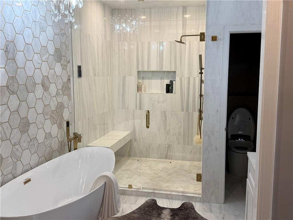 3508 Paces Place Northwest Atlanta, GA 30327 - Photo 19 of 25 a bathroom with a bathtub and shower