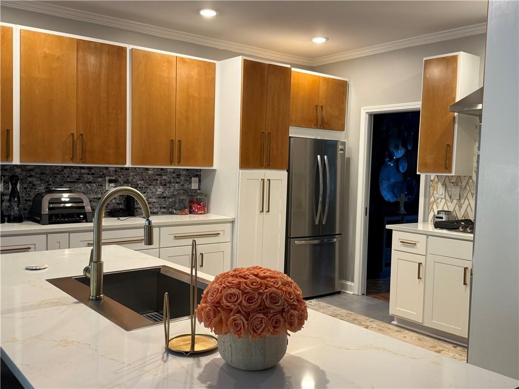 3508 Paces Place Northwest Atlanta, GA 30327 - Photo 4 of 25 a kitchen with a sink cabinets and refrigerator
