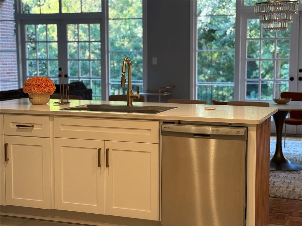 3508 Paces Place Northwest Atlanta, GA 30327 - Photo 6 of 25 a kitchen with stainless steel appliances granite countertop a sink and a window