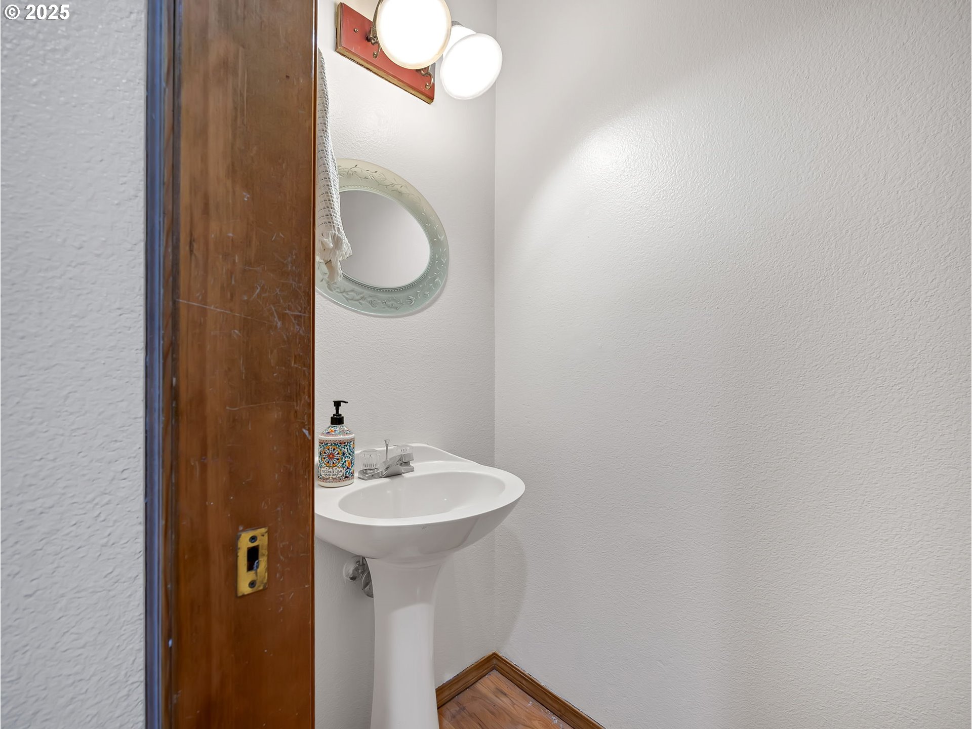 2568 Southwest Orchard Court Gresham, OR 97080 - Photo 15 of 46 a bathroom with a sink and a mirror