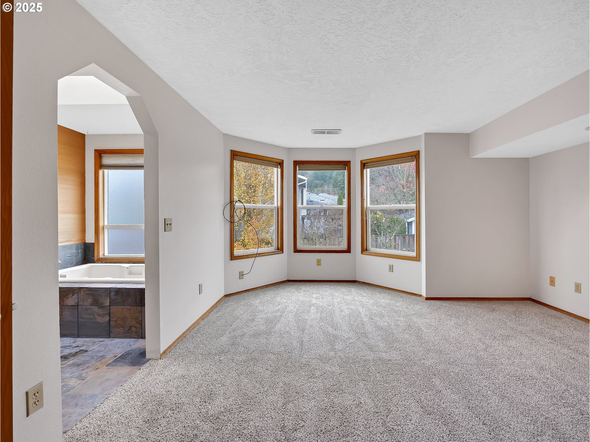 2568 Southwest Orchard Court Gresham, OR 97080 - Photo 23 of 46 an empty room with windows