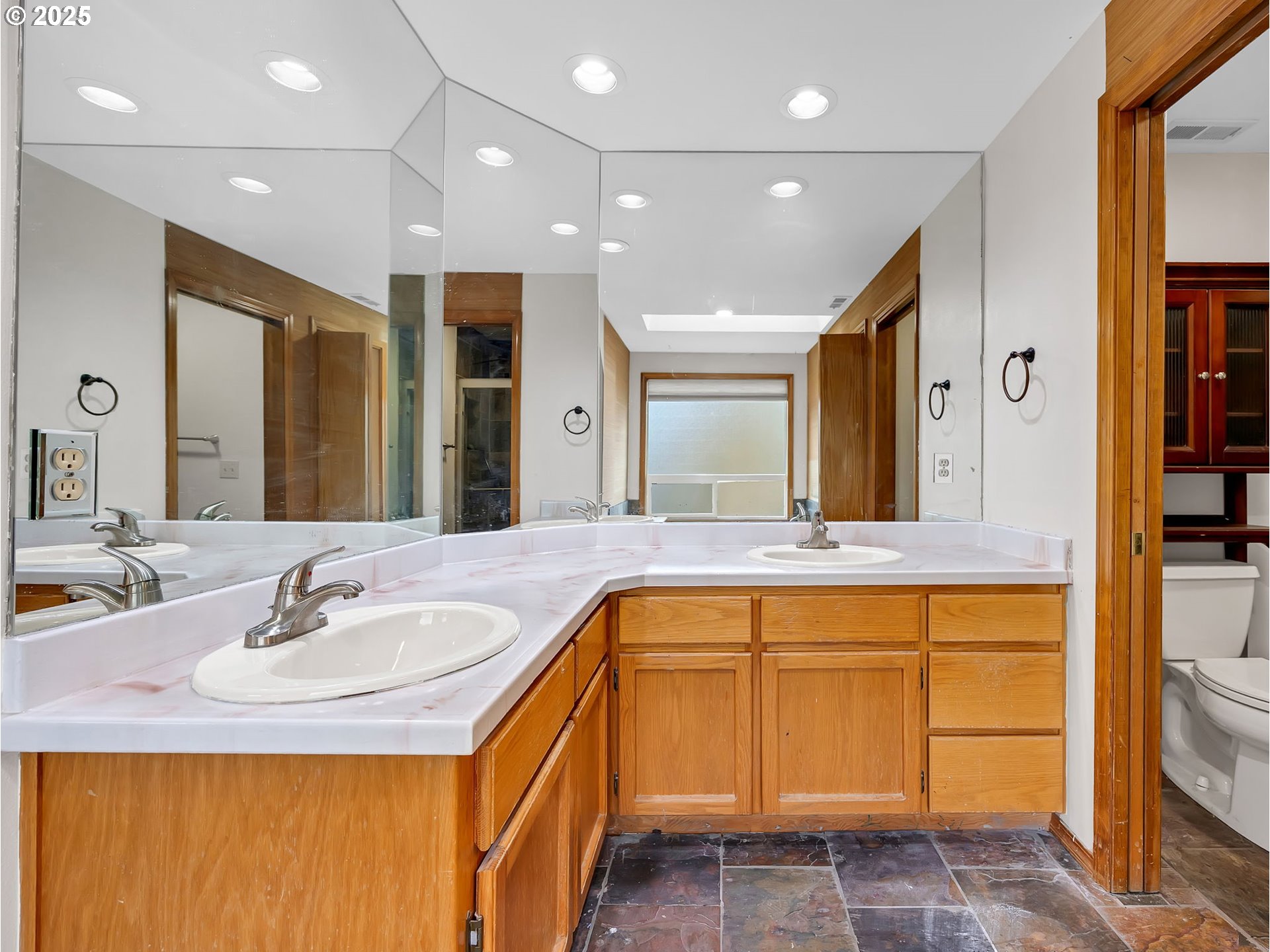2568 Southwest Orchard Court Gresham, OR 97080 - Photo 25 of 46 a bathroom with a sink and a mirror