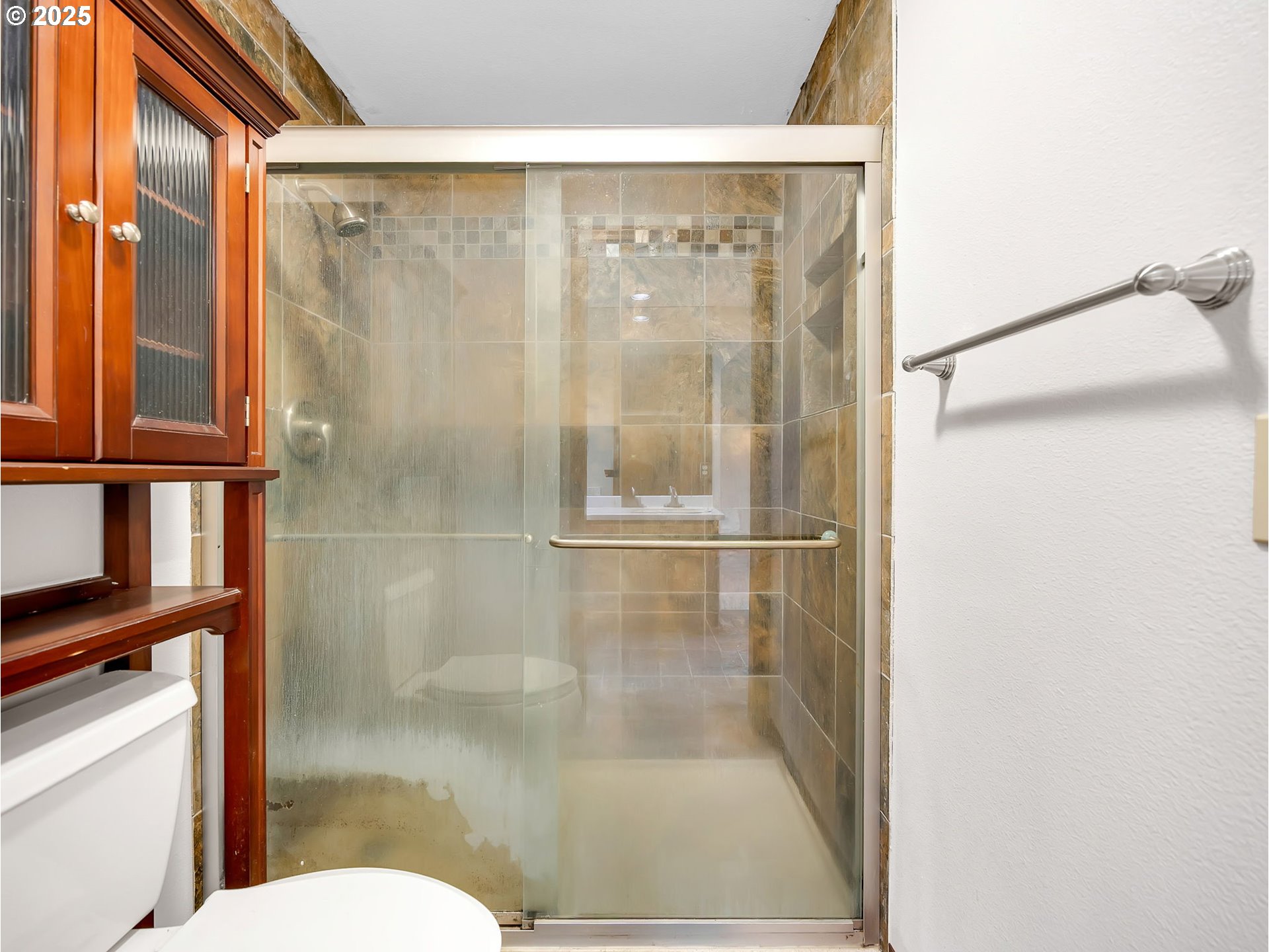 2568 Southwest Orchard Court Gresham, OR 97080 - Photo 27 of 46 a bathroom with a shower and toilet