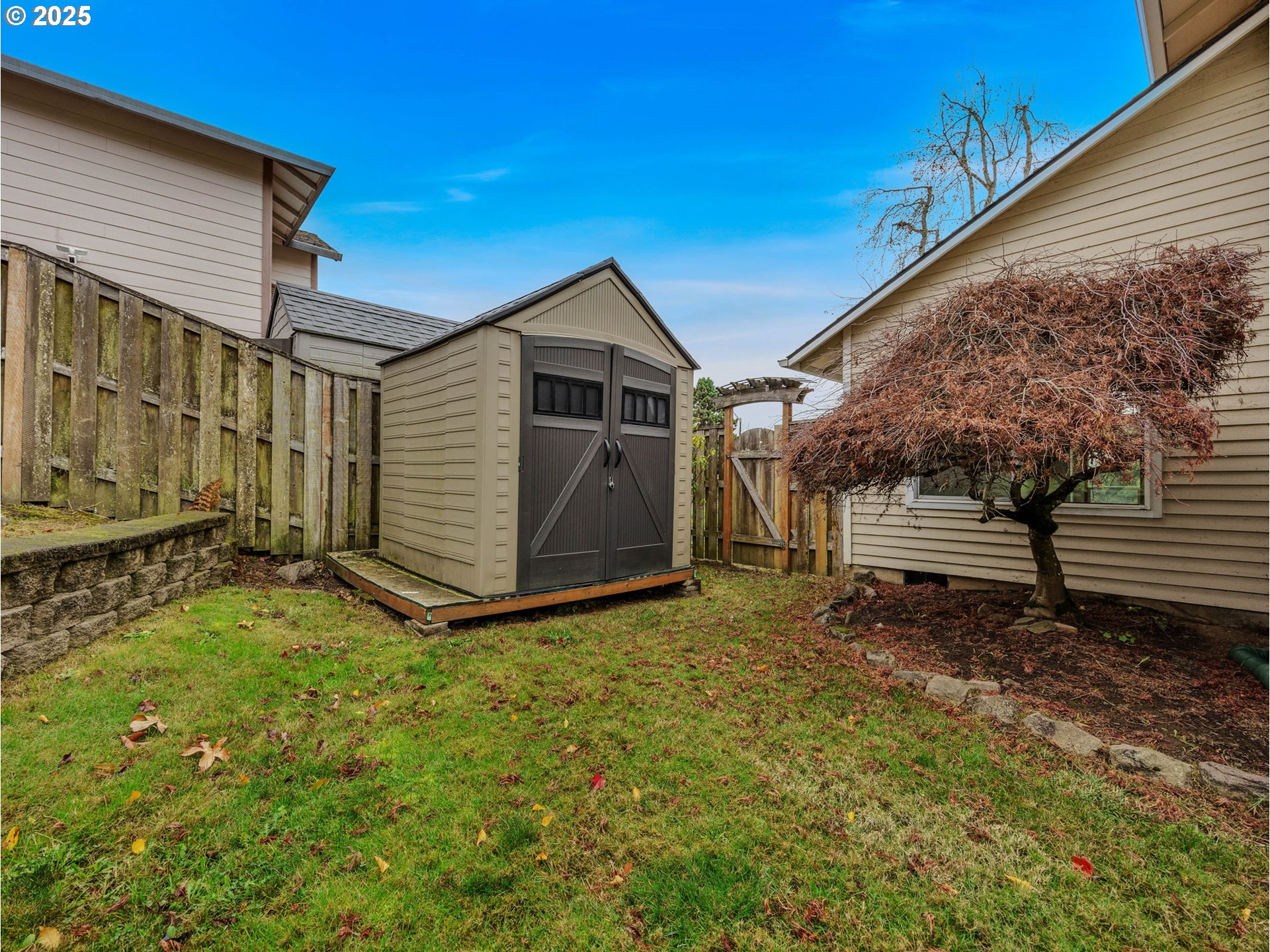2568 Southwest Orchard Court Gresham, OR 97080 - Photo 38 of 46 a view of a house with a yard
