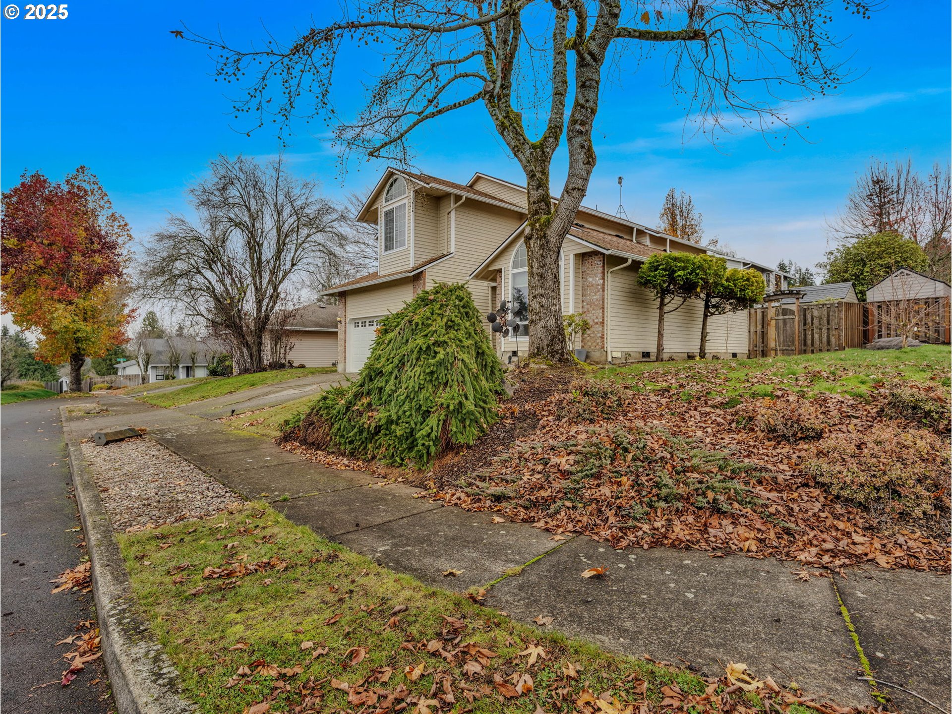 2568 Southwest Orchard Court Gresham, OR 97080 - Photo 44 of 46 a view of a house with a yard