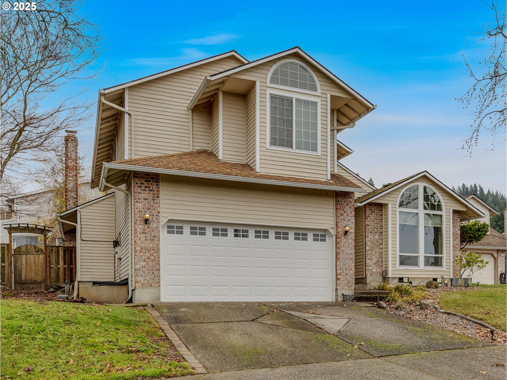 2568 Southwest Orchard Court Gresham, OR 97080 - Photo 45 of 46 a front view of a house with a yard