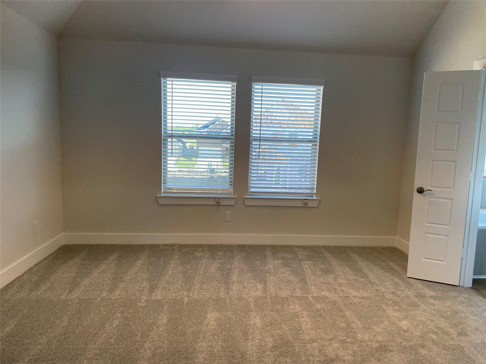 10638 Whitejacket Conroe, TX 77385 - Photo 7 of 25 an empty room with a window
