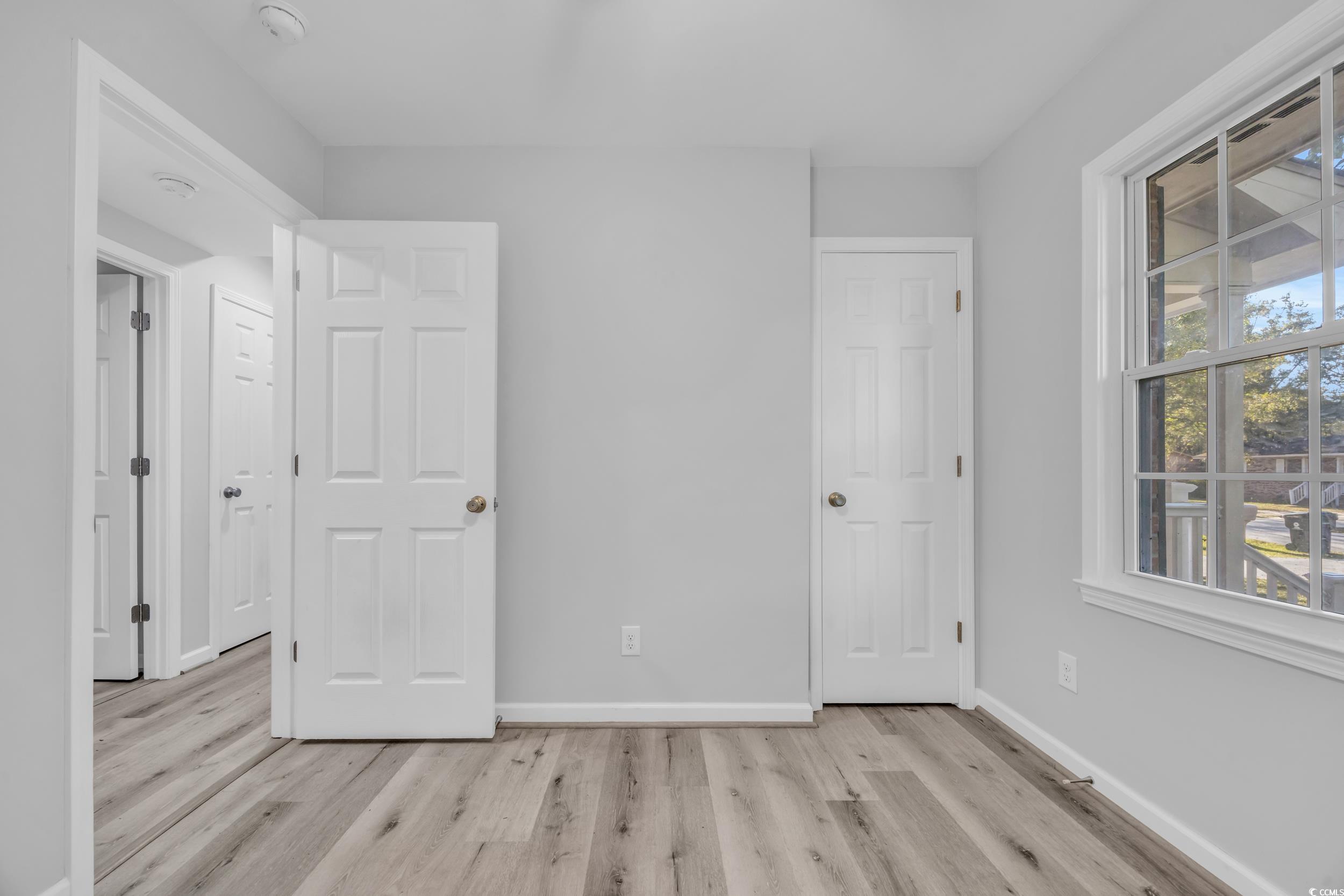 607 Jefferson Way Conway, SC 29526 - Photo 17 of 28 Unfurnished bedroom featuring light hardwood / woo