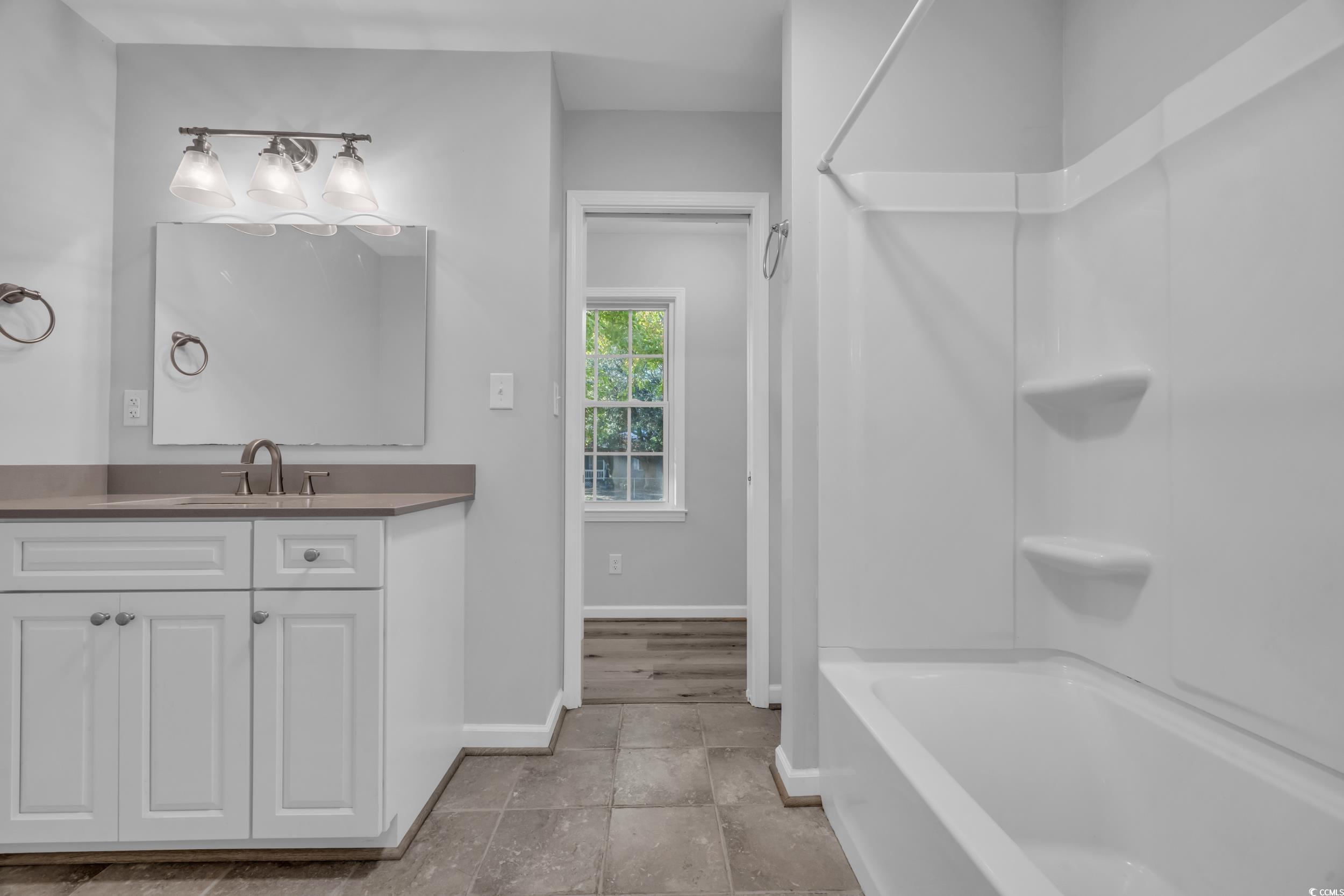 607 Jefferson Way Conway, SC 29526 - Photo 20 of 28 Bathroom featuring vanity and bathing tub / shower