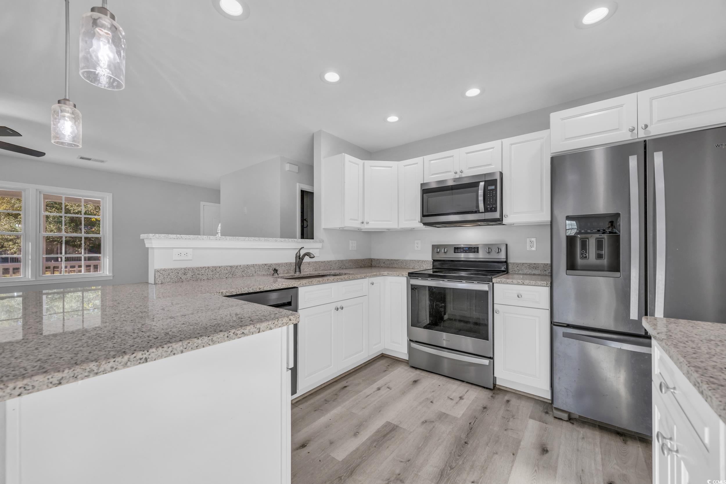 607 Jefferson Way Conway, SC 29526 - Photo 2 of 28 Kitchen featuring white cabinets, appliances with