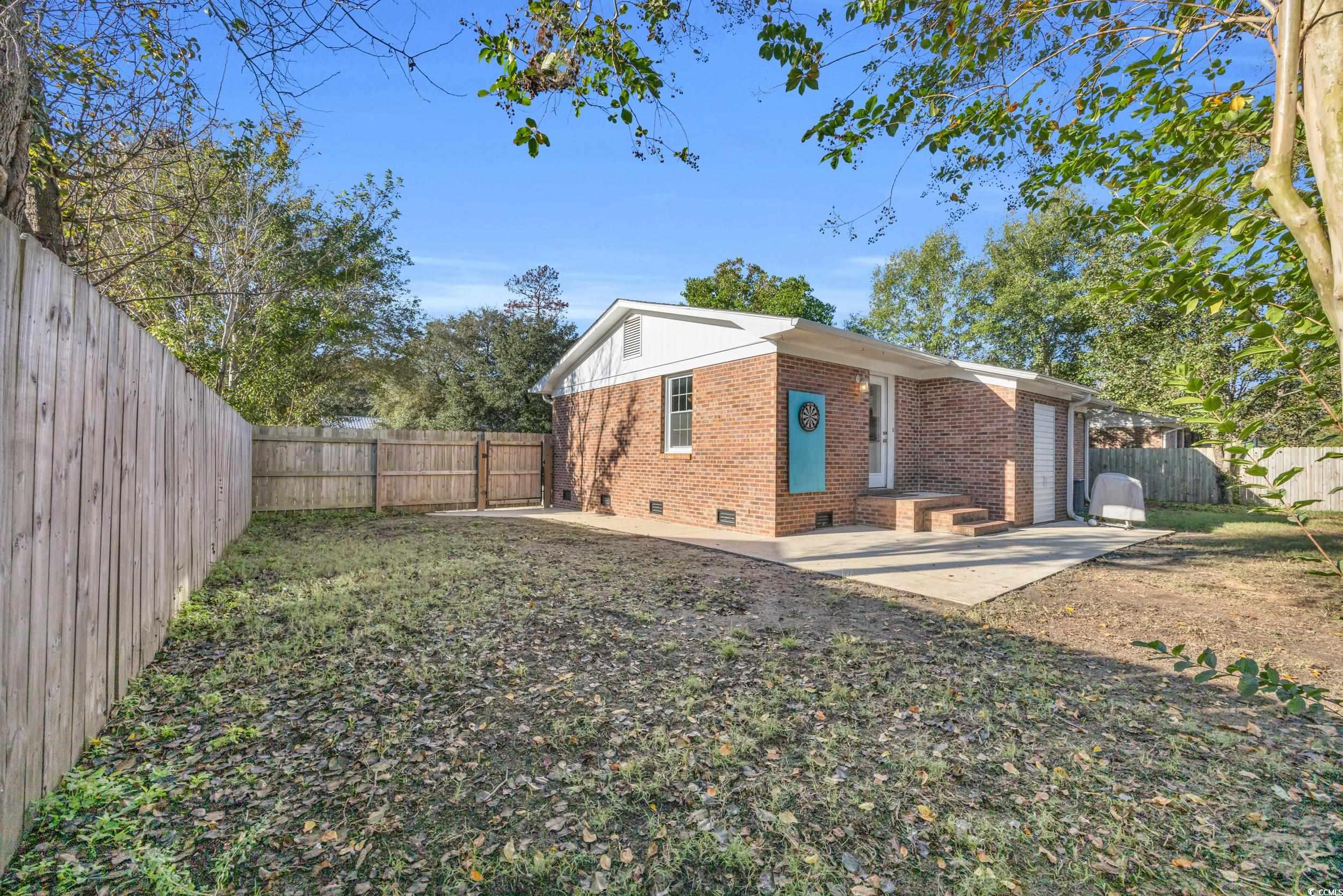 607 Jefferson Way Conway, SC 29526 - Photo 22 of 28 Exterior space with a lawn and a patio area