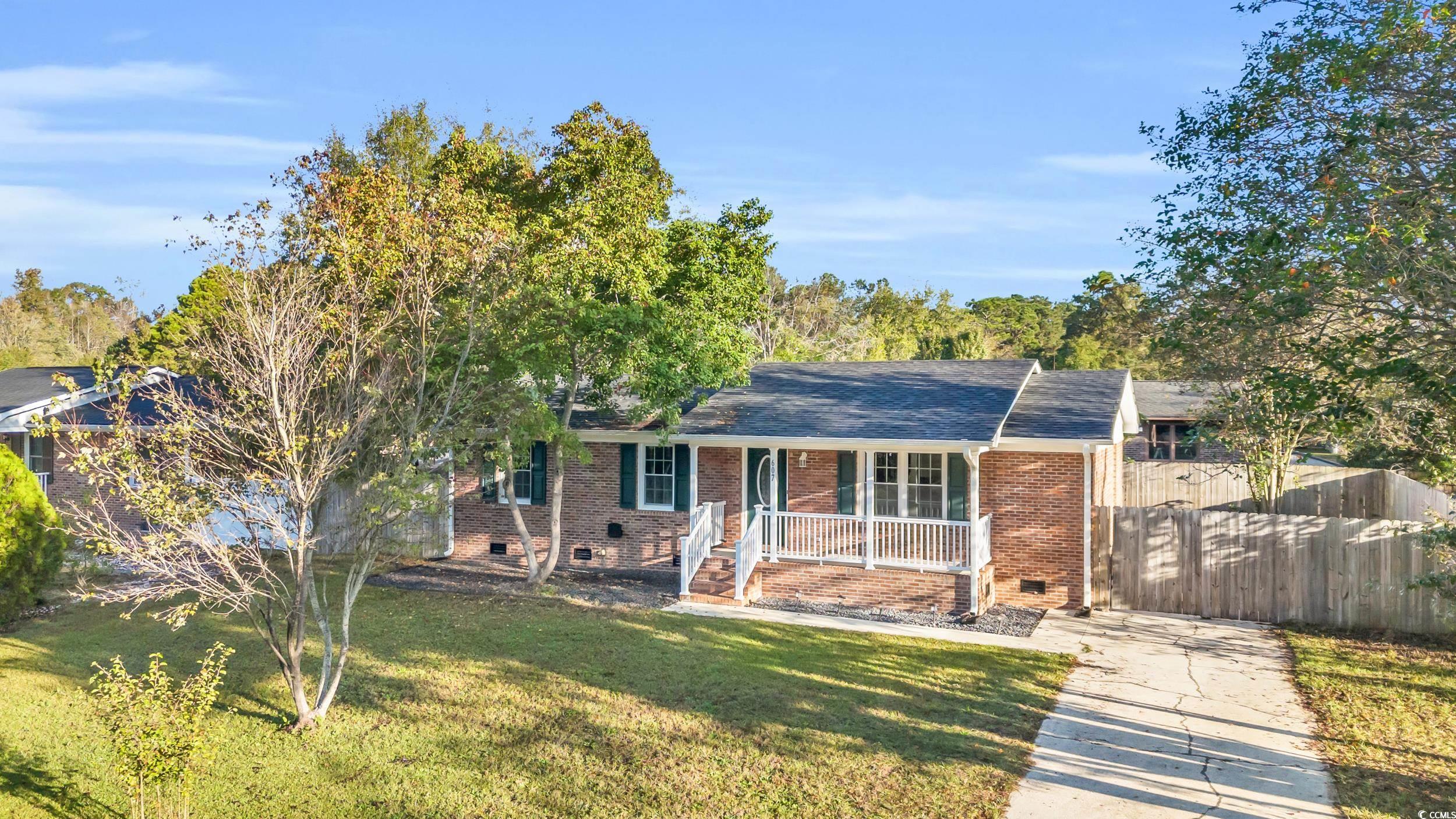 607 Jefferson Way Conway, SC 29526 - Photo 6 of 28 View of front facade with a porch and a front lawn