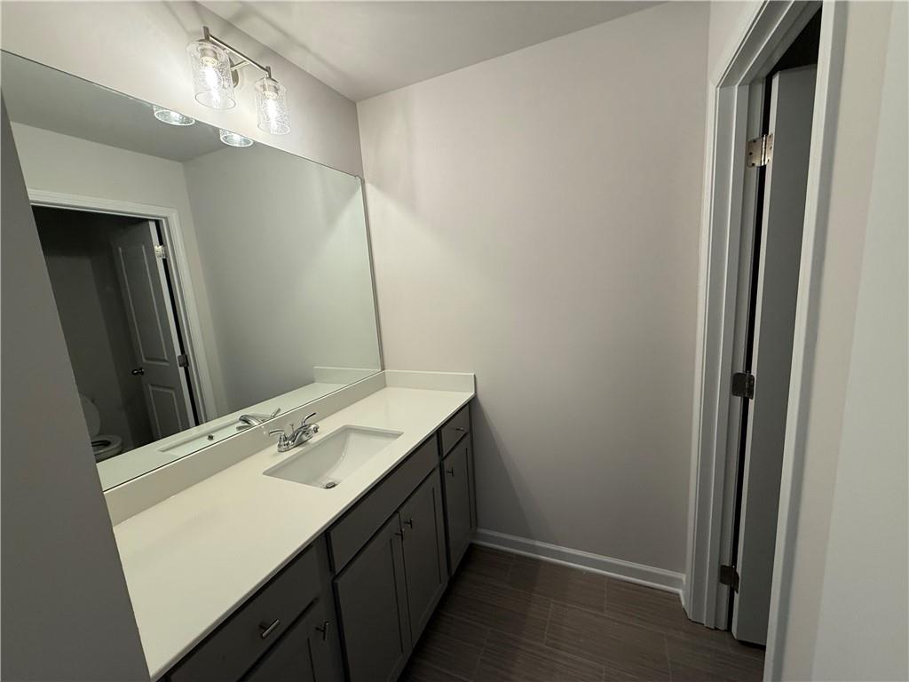 5143 Longview Run Decatur, GA 30035 - Photo 14 of 17 a bathroom with a sink and a mirror