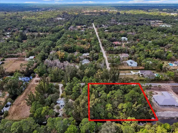 an aerial view of residential houses and outdoor space