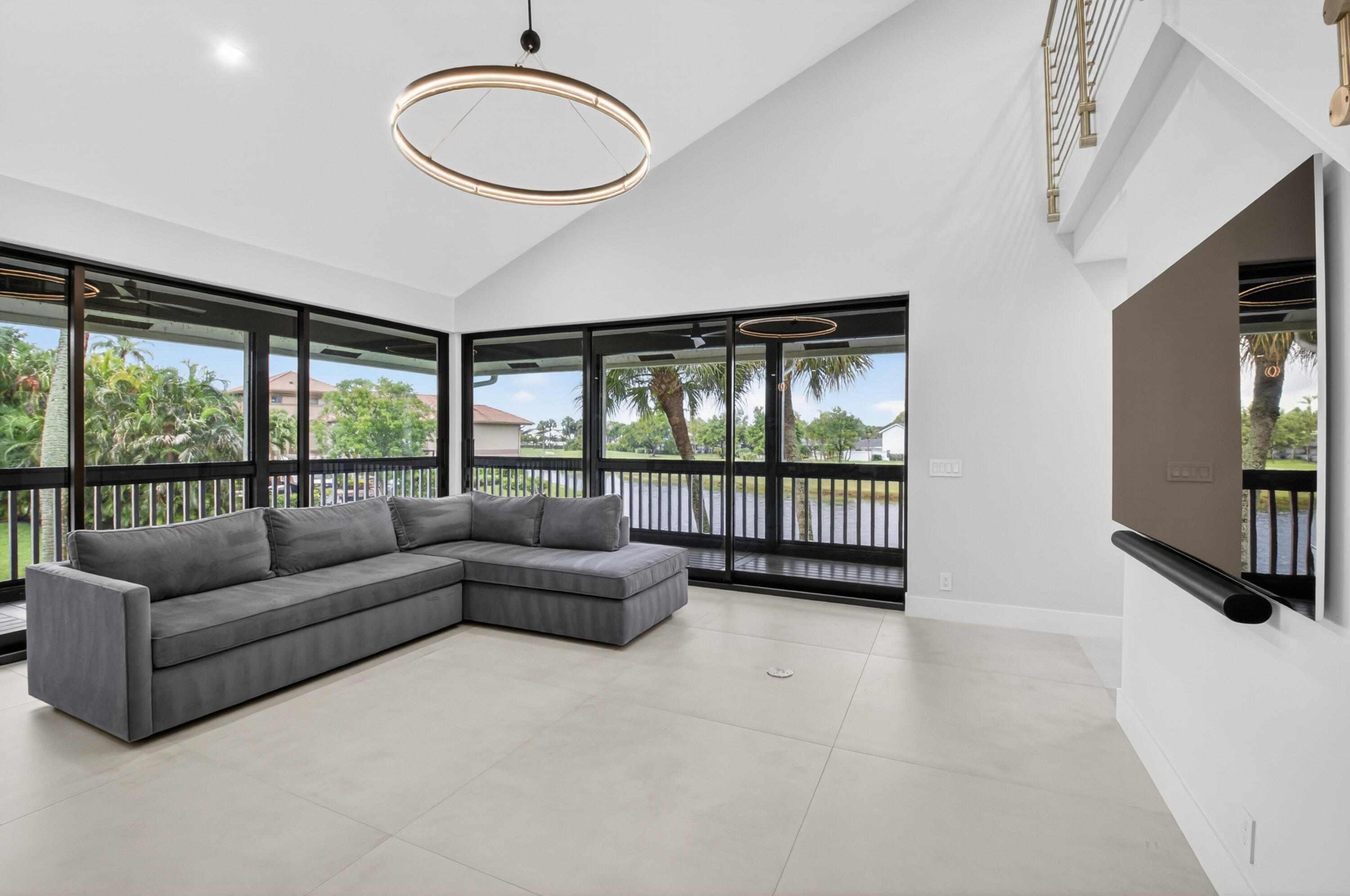 19221 Sabal Lake Drive, Unit 5124 Boca Raton, FL 33434 - Photo 17 of 98 a living room with furniture and a large window