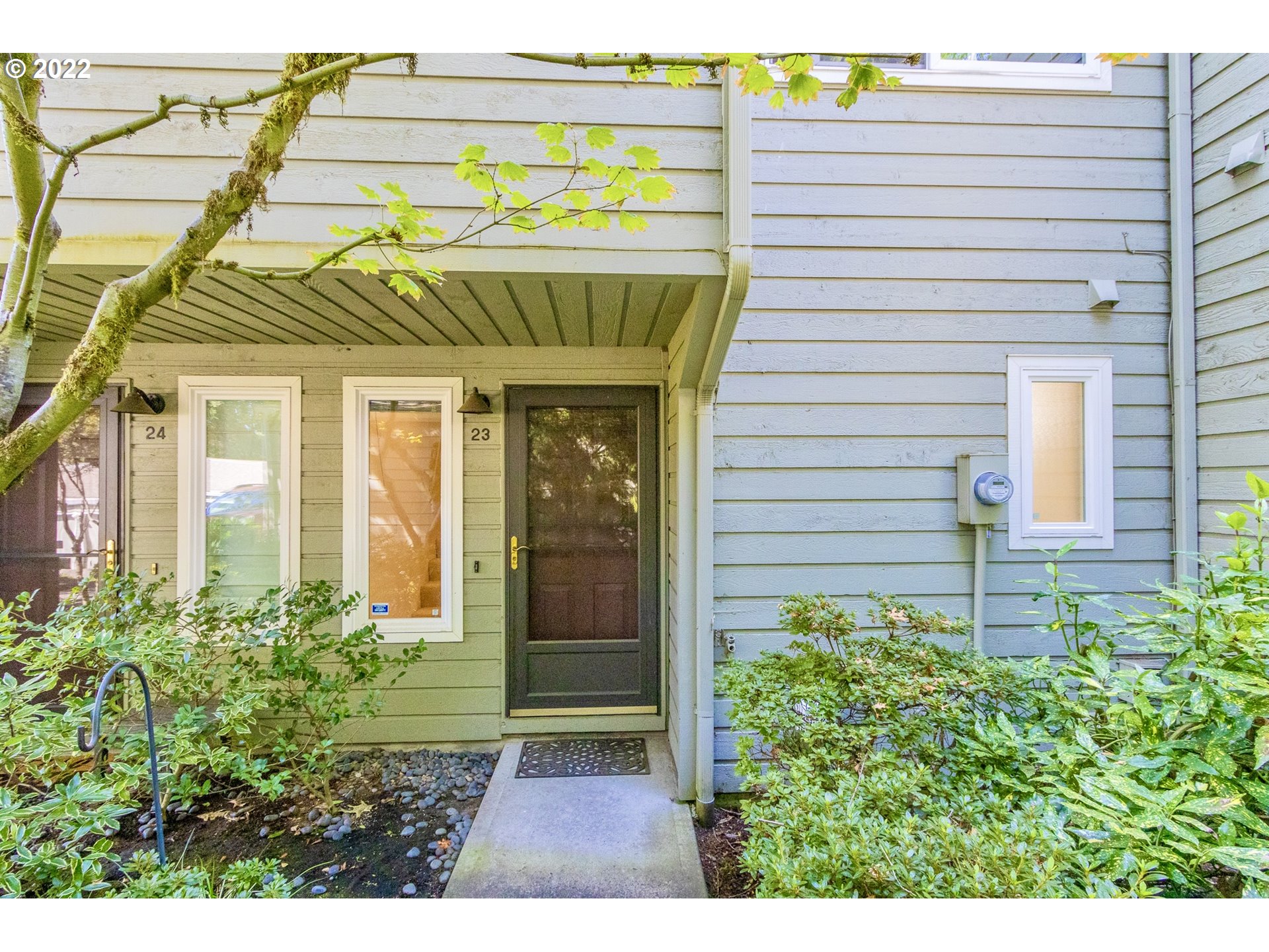 4880 Southwest Scholls Ferry Road, Unit 23 Portland, OR 97225 - Photo 3 of 17 a view of a house with a window and potted plants
