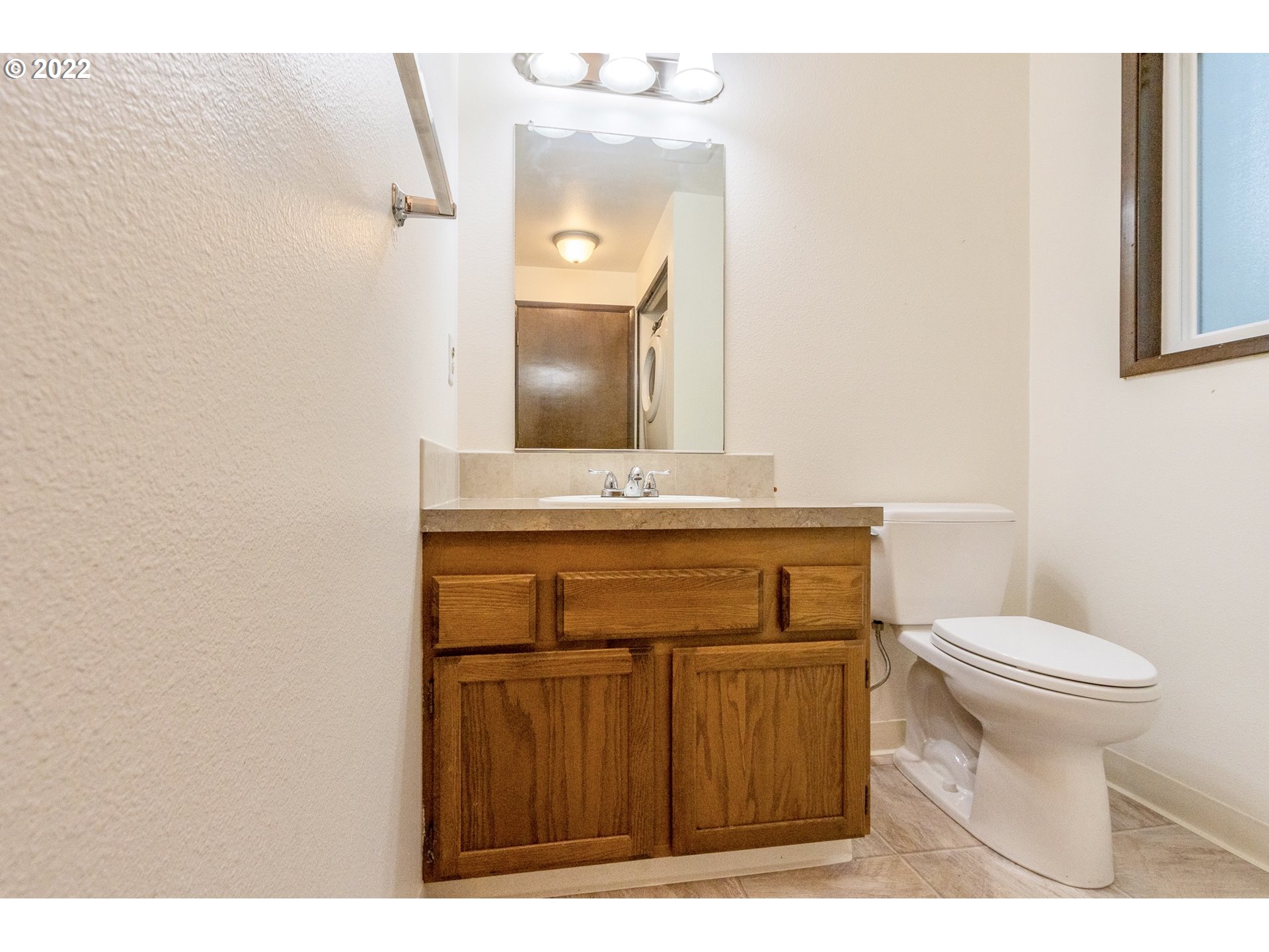 4880 Southwest Scholls Ferry Road, Unit 23 Portland, OR 97225 - Photo 7 of 17 a bathroom with a sink and a toilet