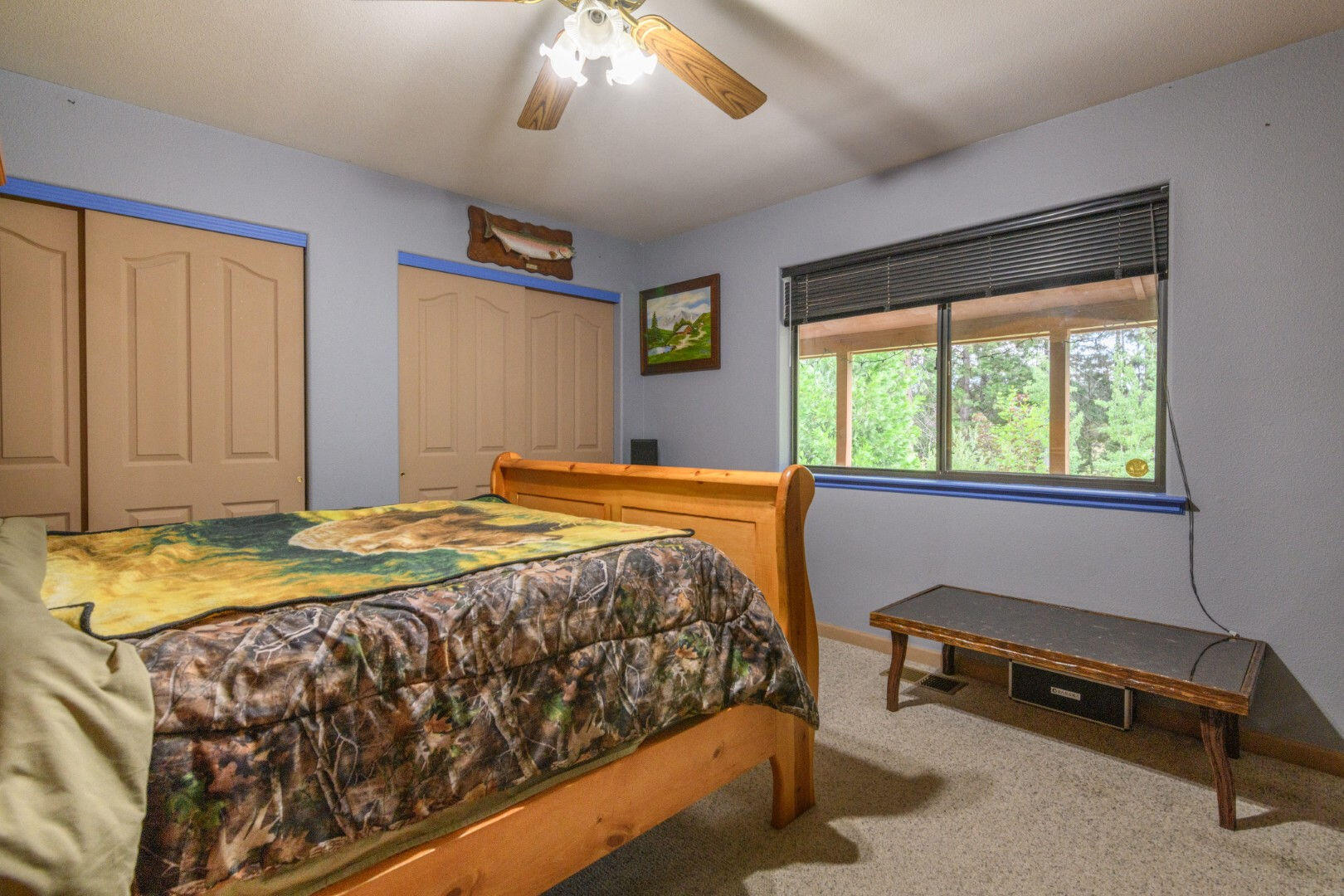 36088 Deer Flat Road Shingletown, CA 96088 - Photo 13 of 23 a bedroom with a bed and a window
