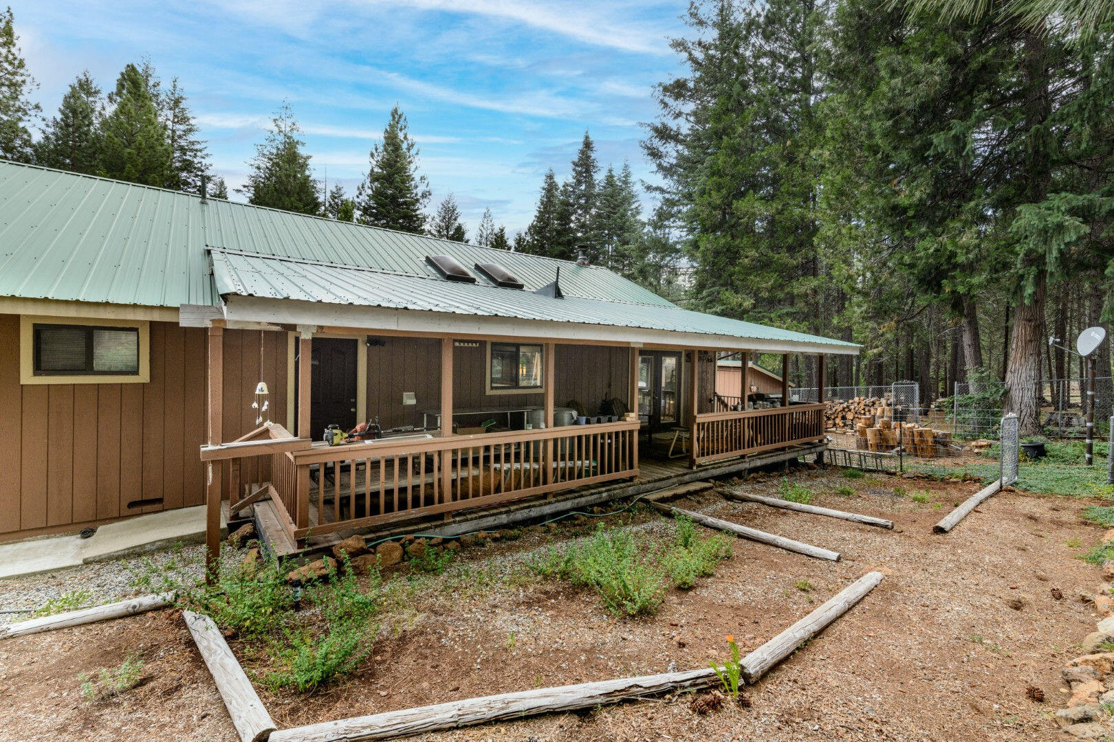 36088 Deer Flat Road Shingletown, CA 96088 - Photo 16 of 21 a view of a house with backyard and sitting area