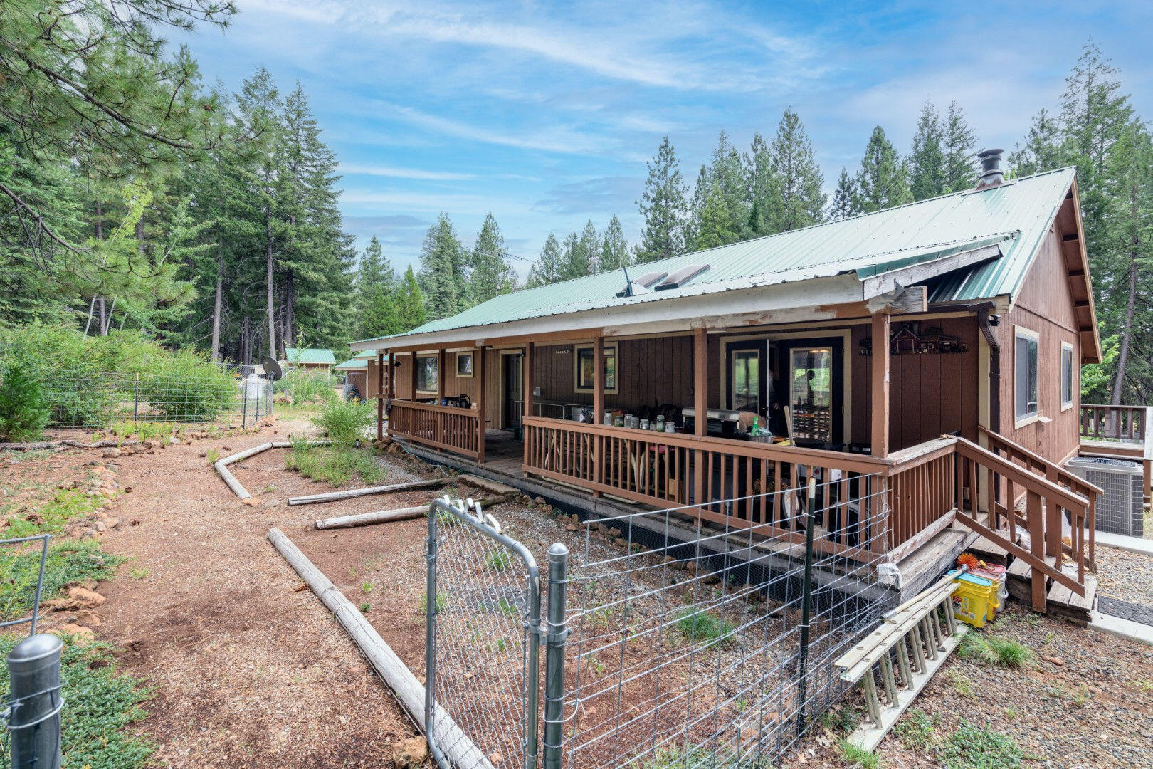 36088 Deer Flat Road Shingletown, CA 96088 - Photo 19 of 21 a house with trees in the background