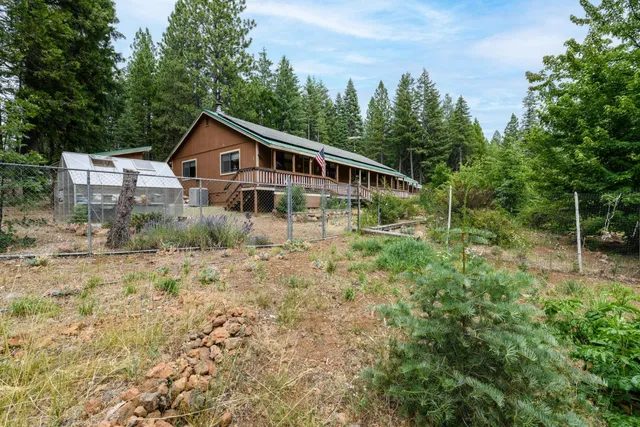 a house with trees in the background