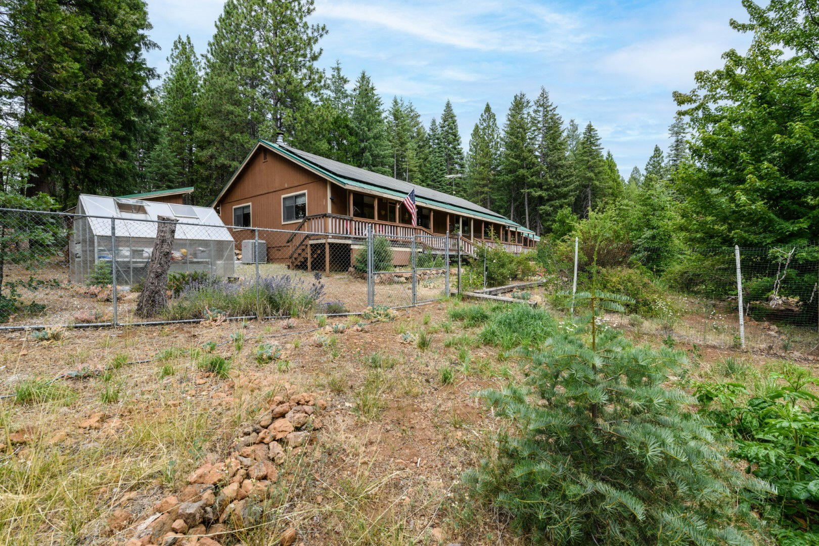 36088 Deer Flat Road Shingletown, CA 96088 - Photo 20 of 21 a house with trees in the background
