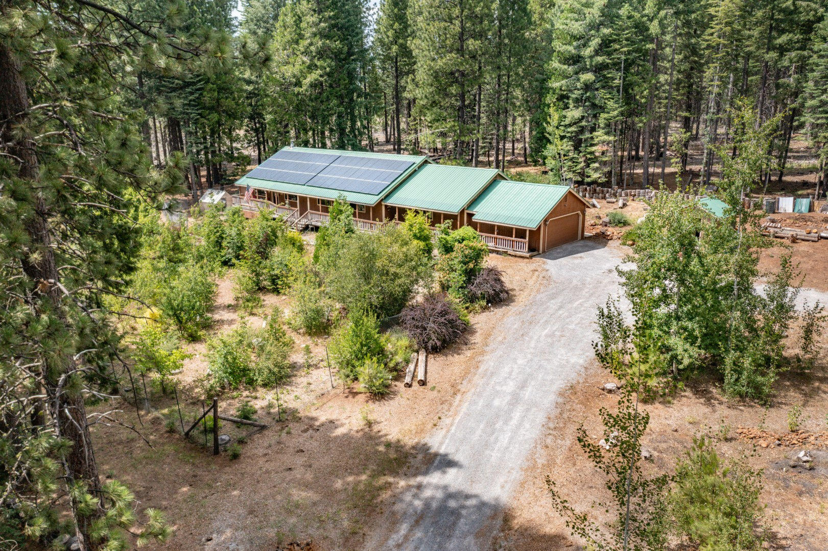 36088 Deer Flat Road Shingletown, CA 96088 - Photo 4 of 21 an aerial view of a house with yard and outdoor seating