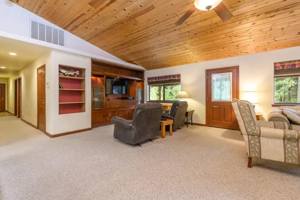 a view of a livingroom with furniture and windows