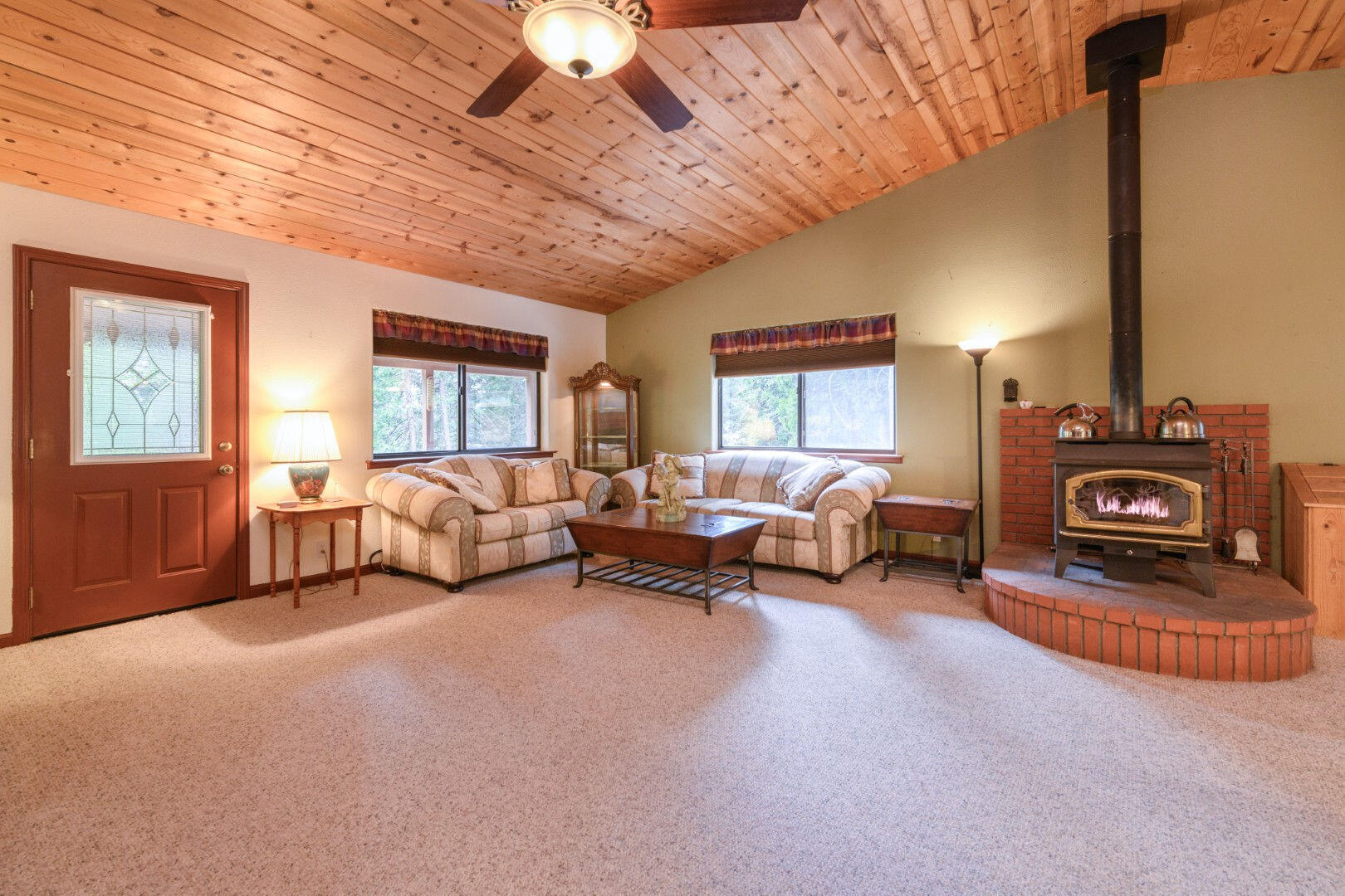 36088 Deer Flat Road Shingletown, CA 96088 - Photo 10 of 23 a spacious bedroom with furniture and a fireplace
