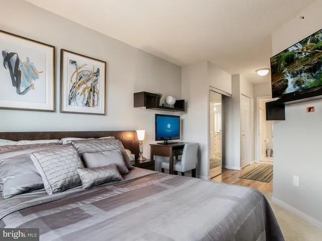 a bedroom with a bed and a couch