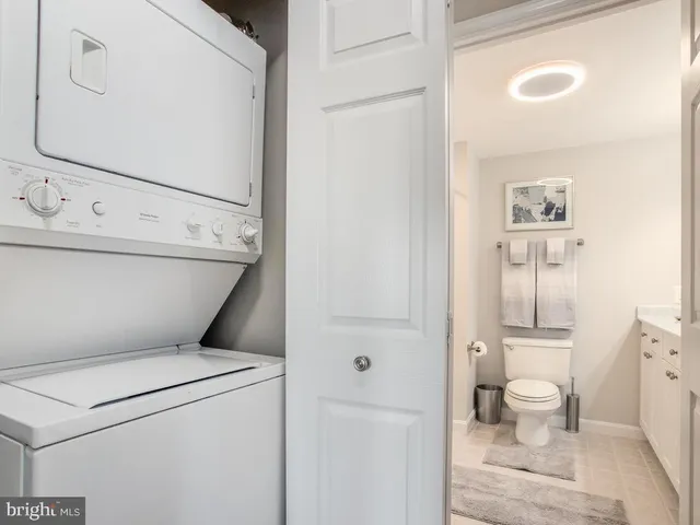 a view of bathroom with a toilet and a view of bathroom