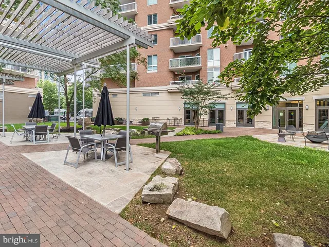 a view of a swimming pool and lounge chairs
