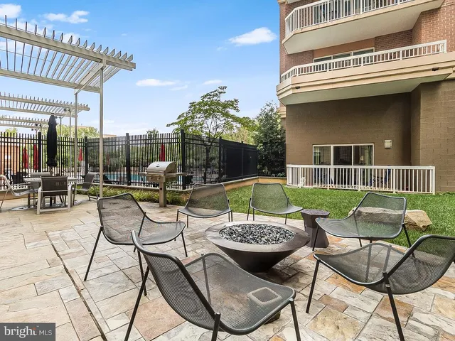a view of swimming pool with outdoor seating