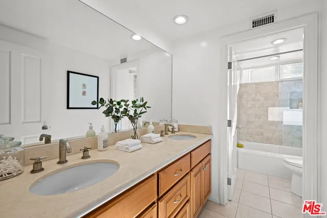 a house that has a tree in front of it