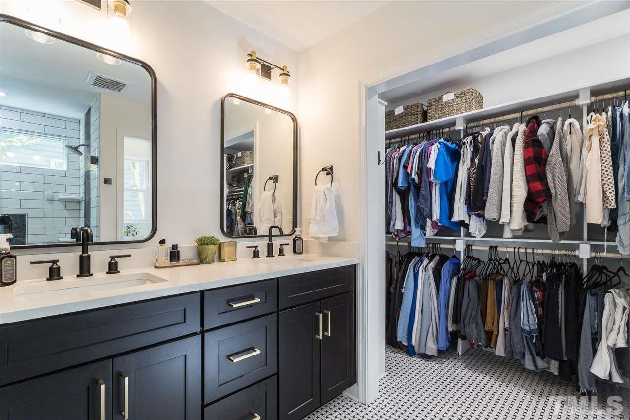 5436 Ingate Way Raleigh, NC 27613 - Photo 22 of 30 a bathroom with a double vanity sink and a mirror