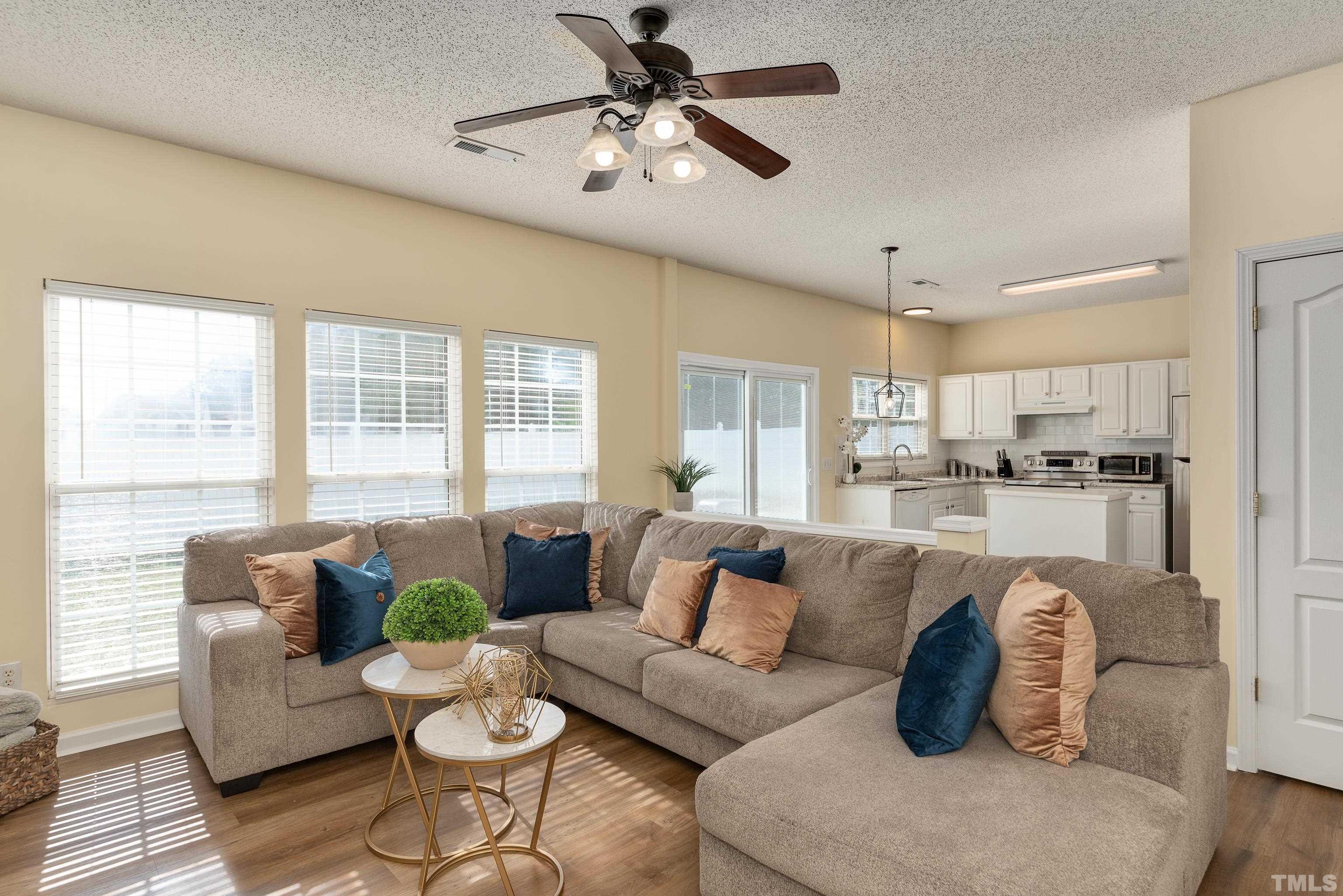 2901 Ranburne Drive Raleigh, NC 27610 - Photo 13 of 29 a living room with furniture kitchen view and a large window