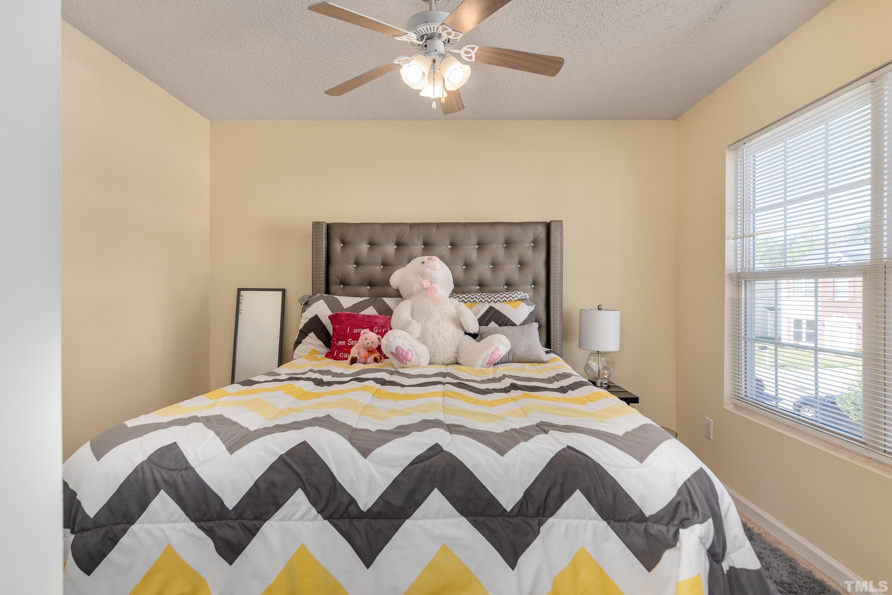 2901 Ranburne Drive Raleigh, NC 27610 - Photo 24 of 29 a bedroom with a bed and a window