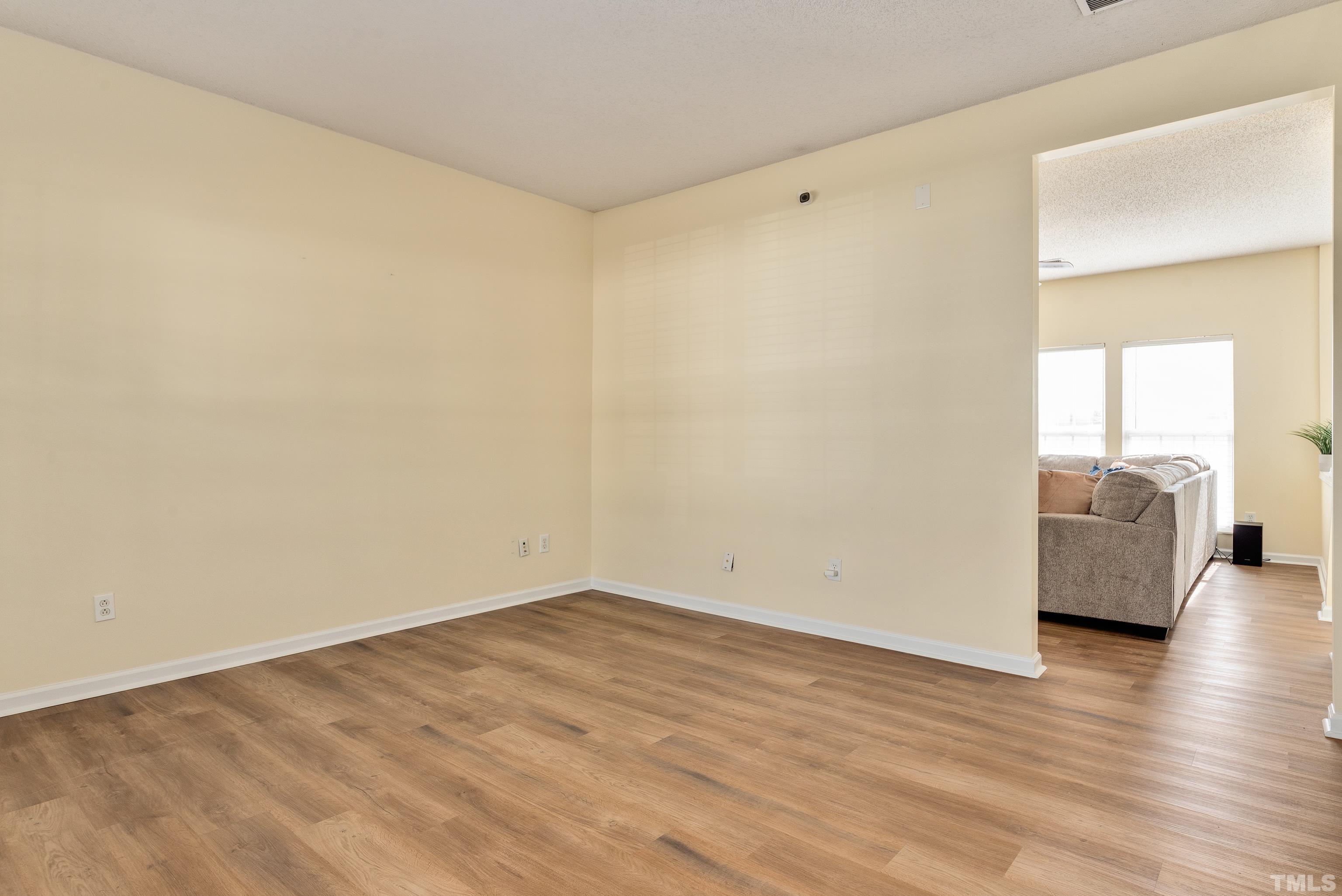 2901 Ranburne Drive Raleigh, NC 27610 - Photo 7 of 29 a view of a room with wooden floor and a sink