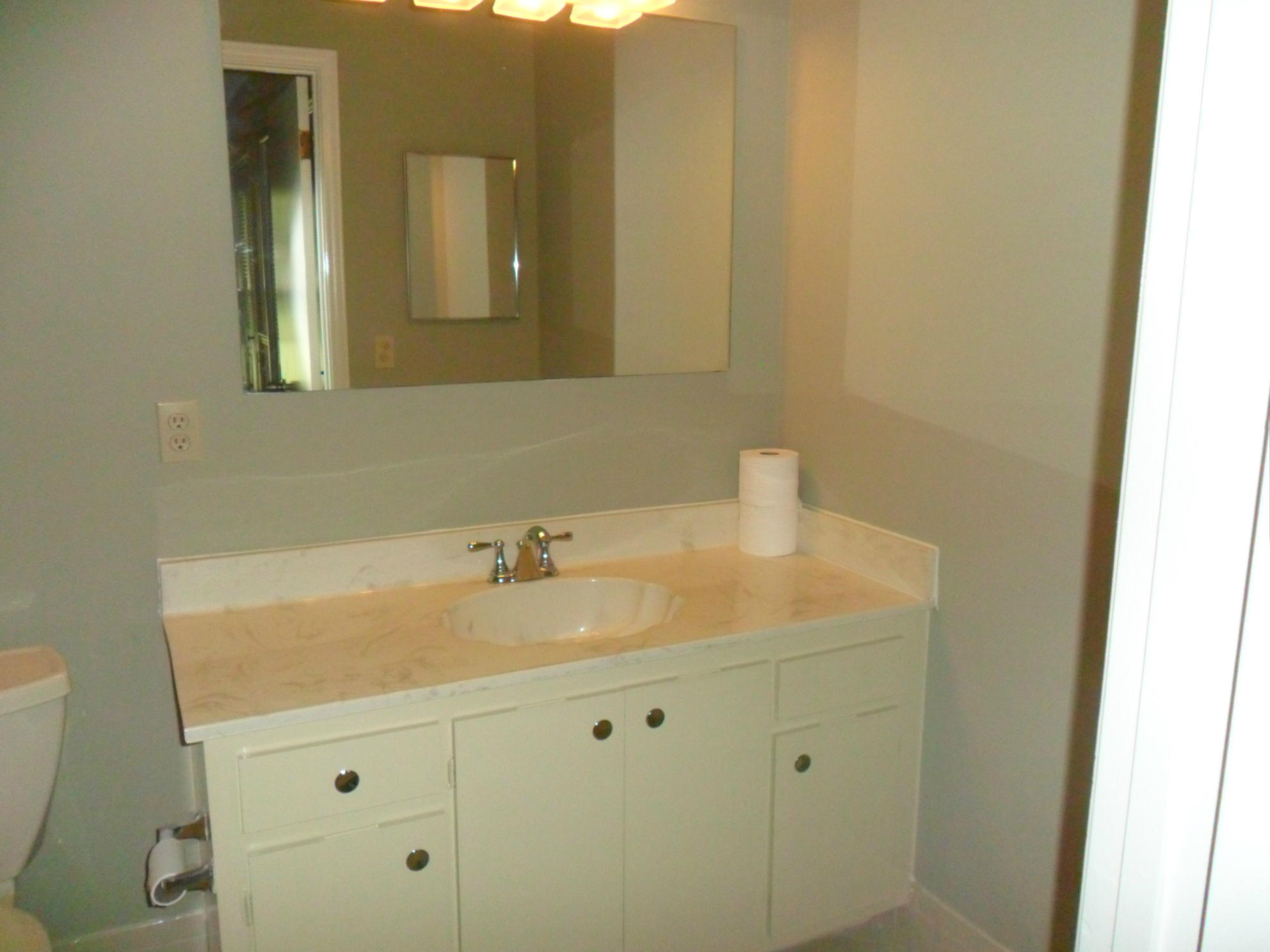 6311 Lasalle Road Delray Beach, FL 33484 - Photo 21 of 34 a bathroom with a sink and a mirror