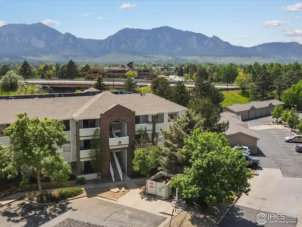 a view of a patio with a garden and mountain view