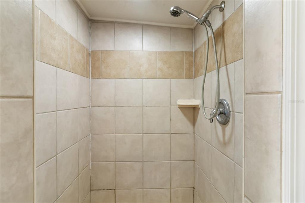 712 4th Street St. Cloud, FL 34769 - Photo 22 of 30 a bathroom with a shower