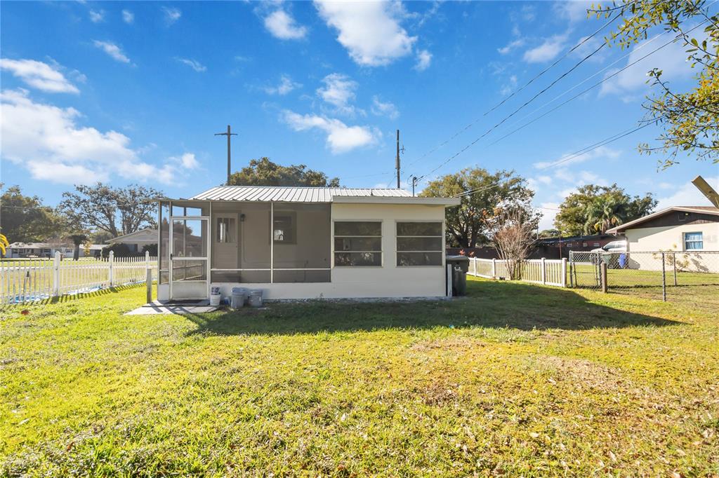 712 4th Street St. Cloud, FL 34769 - Photo 29 of 30 a view of a house with a big yard and swimming pool