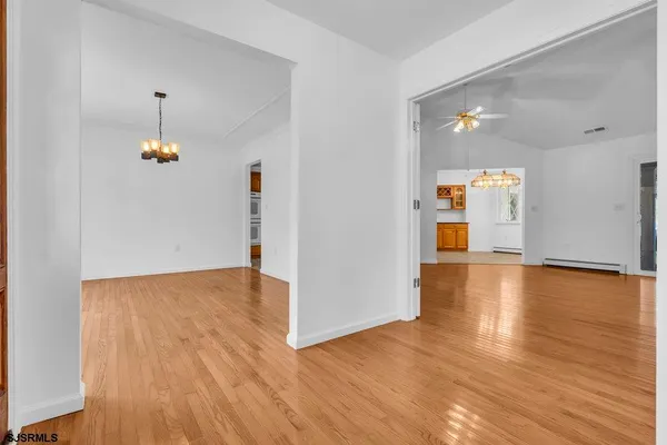 a kitchen with stainless steel appliances granite countertop a sink a refrigerator and a granite counter tops