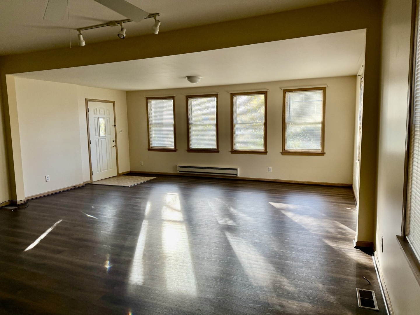 422 Chartres Street LaSalle, IL 61301 - Photo 6 of 21 an empty room with wooden floor and windows