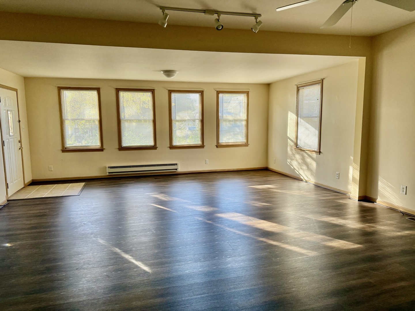 422 Chartres Street LaSalle, IL 61301 - Photo 7 of 21 a view of an empty room with wooden floor and a window