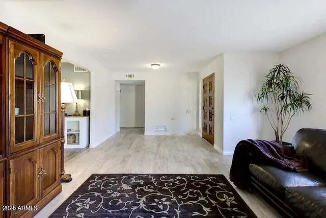 a bedroom with furniture and a window