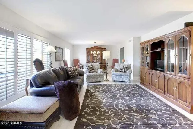a living room with furniture and a rug