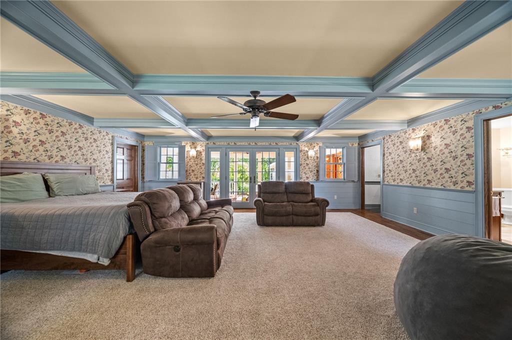 21368 Church Street Venango, PA 16440 - Photo 17 of 49 a living room with furniture a ceiling fan and a large window