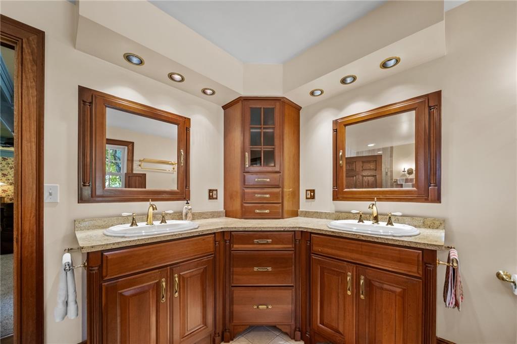 21368 Church Street Venango, PA 16440 - Photo 19 of 49 a bathroom with a sink double vanity and a mirror